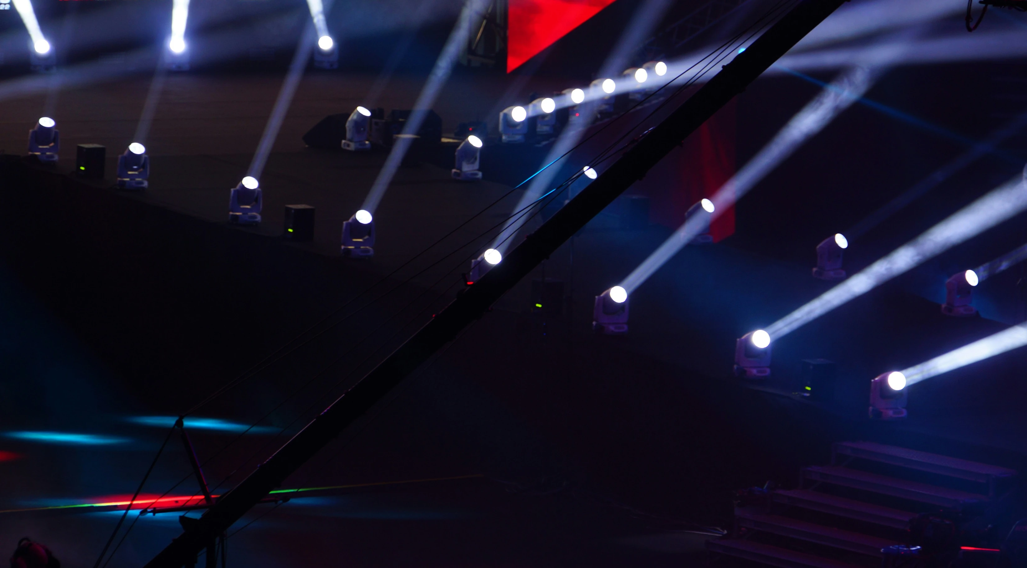 Professional stage lighting with white and blue light beams at Awards Night